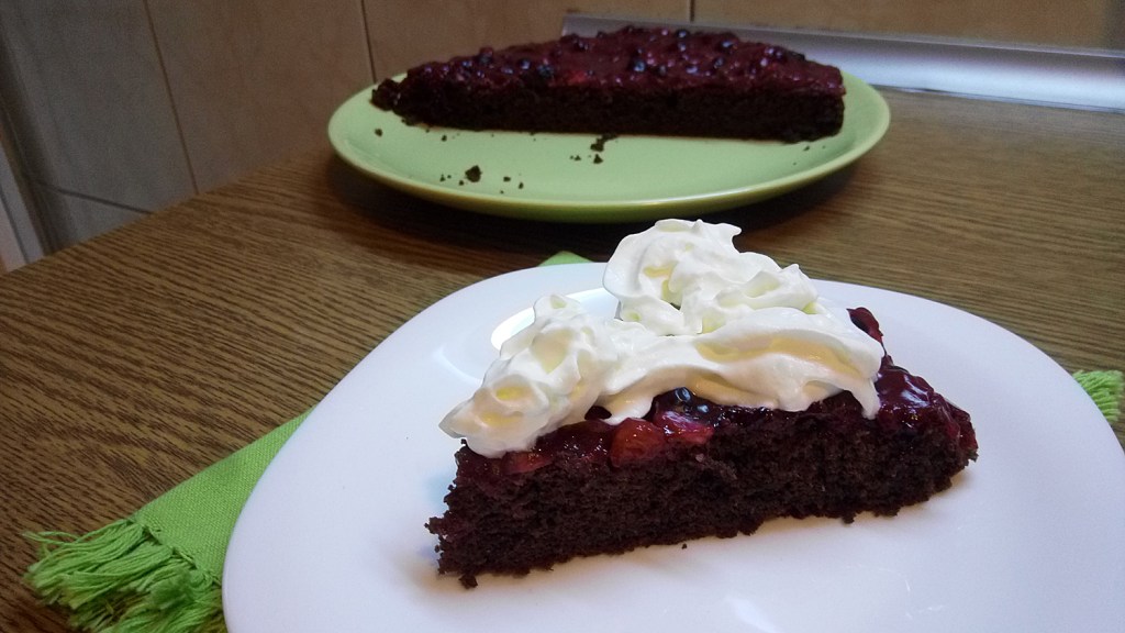 Quick & Easy gluten-free, sugar-free cocoa cake with forest fruit topping. Serve with shipped cream.