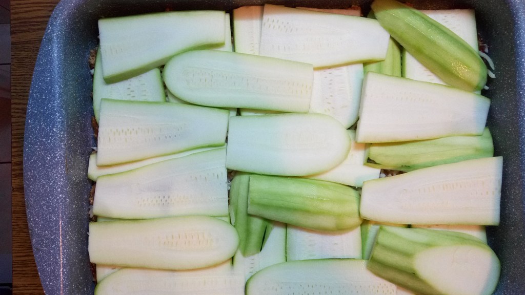 Adding the second half of the zucchini slices