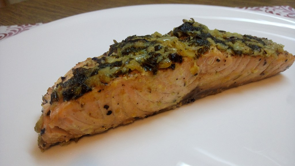 Salmon in parchment paper pockets, with a garlic, lime juice, and Dijon mustard marinade
