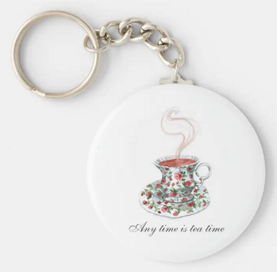 Any time is tea time. Tea slogan keychain with a vintage cup with red roses