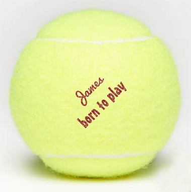 Tennis ball with the slogan "born to play" and a personalized name