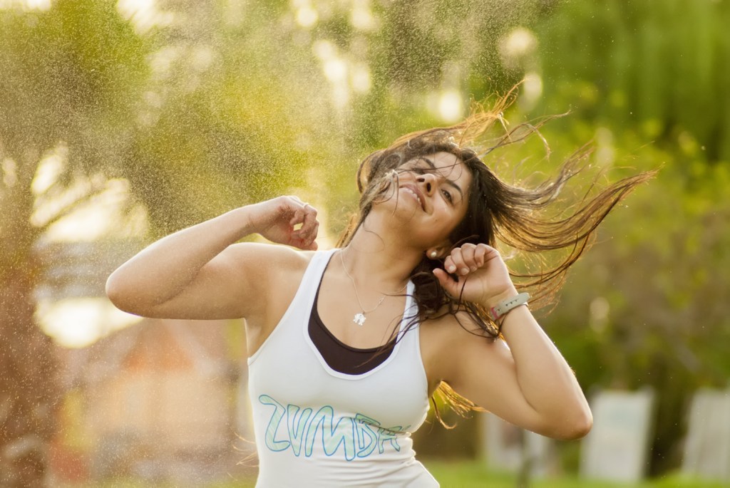 Woman busting some Zumba (R) moves
