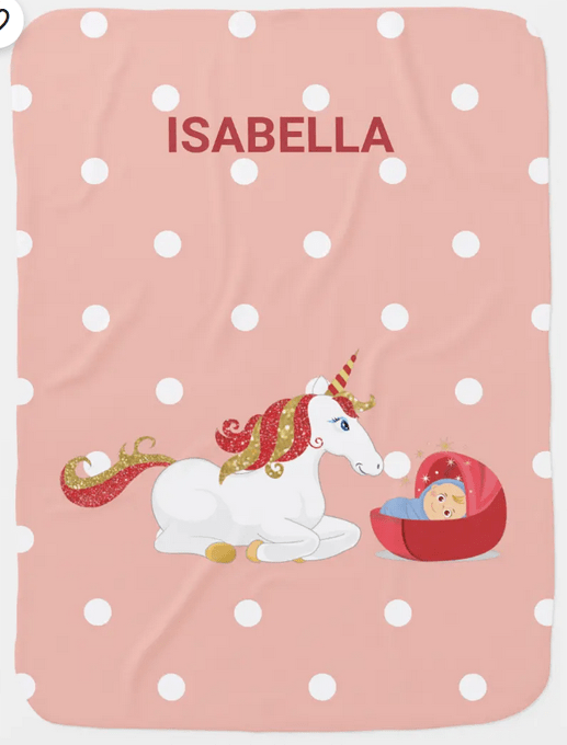 Customized name blanket for a newborn with a kneeling unicorn; pink shade with white polka dots