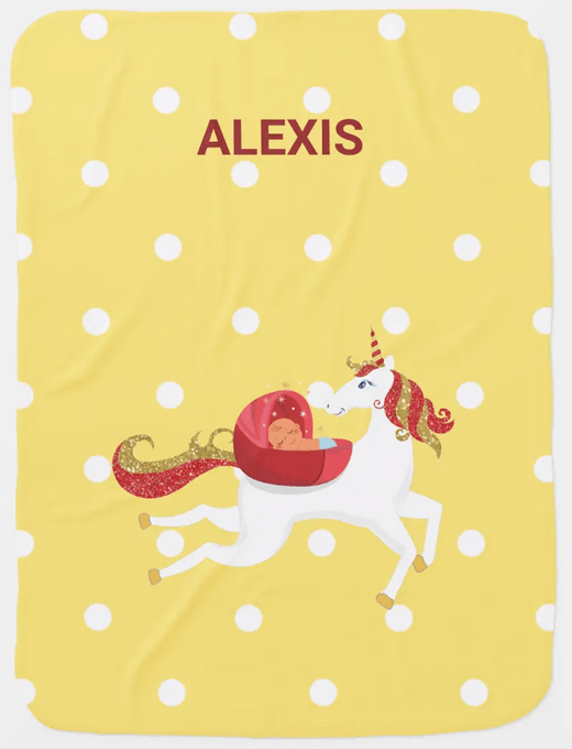 Custom name blanket for a newborn, with a flying unicorn and a yellow background with white polka dots