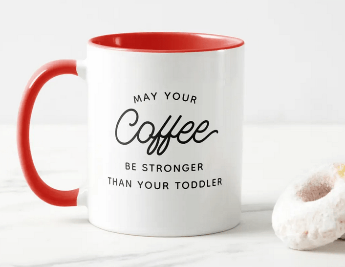 Funny mug for frazzled parents, with the quote May your coffee be stronger than your toddler