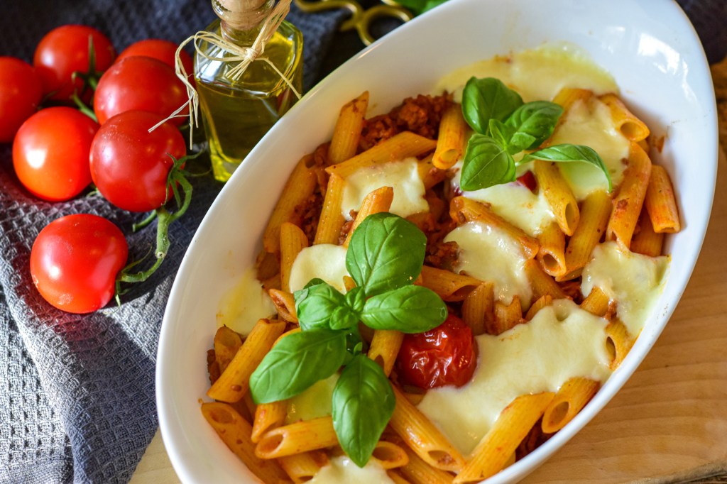 Rigatoni with tomato sauce, olive oil, meat, cheese, and basil