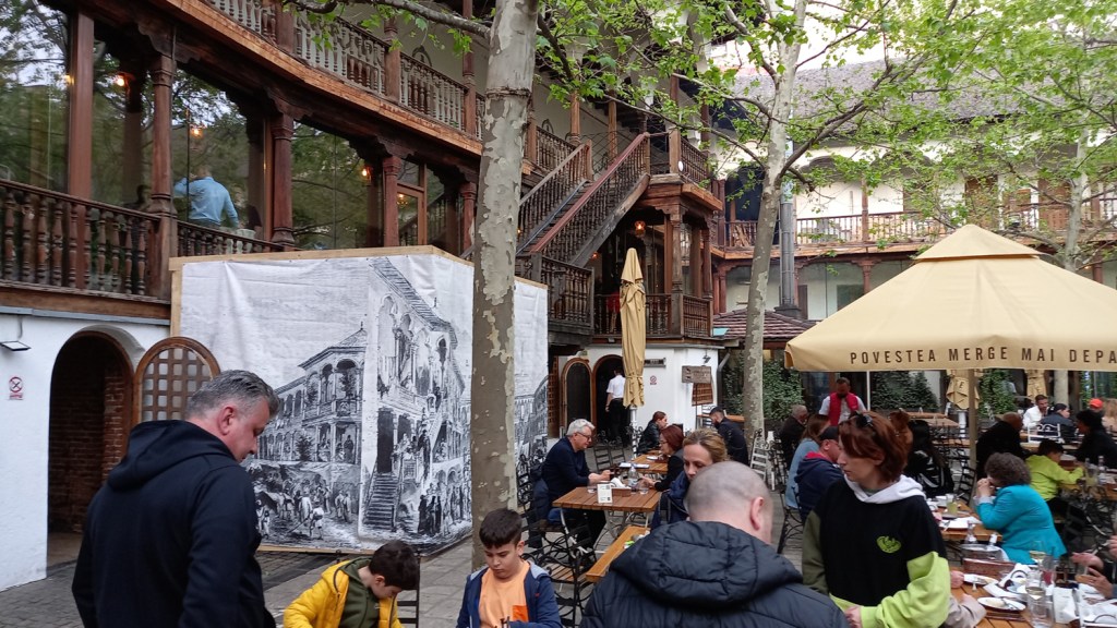 Inner courtyard of Manuc's Inn in Bucharest's Old Town, showing some of the architecture and customers at tables