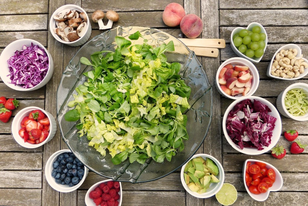Greens salad, along with strawberries, blueberries, avocado, tomatoes, grapes, and other foods that help lower cholesterol. Review of Chef Alain Braux's book How to Lower Your Cholesterol with French Gourmet Food