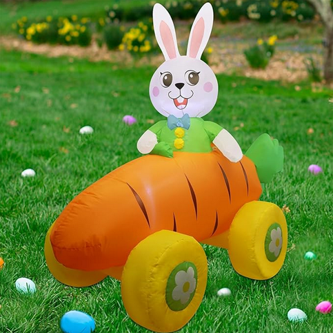 Cute inflatable yard decoration for Easter with a smiling bunny rabbit in a carrot-shaped car