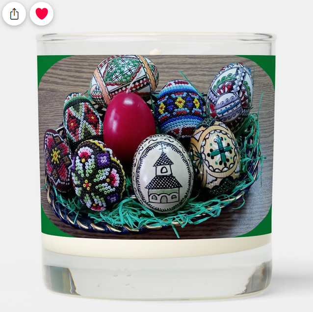 Scented religious Easter candle with the Bible verse "He is Risen" + "Happy Easter!"
and a personalized family name. With a basket of decorated Easter eggs shown larger on the back.