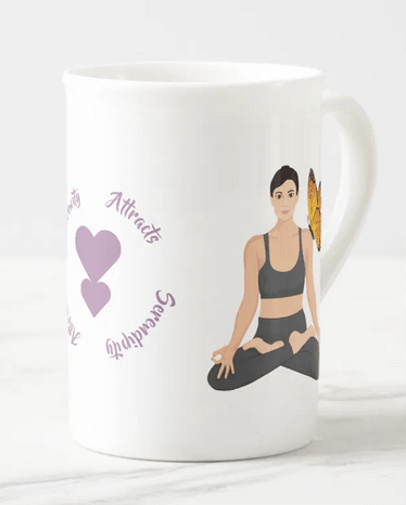 Elegant bone china mug with an illustration of a girl in lotus pose, butterfly resting on her shoulder, and a serenity and serendipity quote, along with one heart growing from another (© Mira)