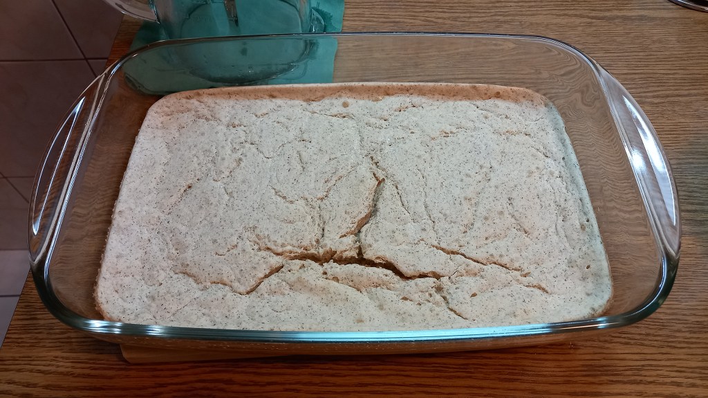 GF oven-baked pancake in a glass tray, taken out of the oven after 45 mins