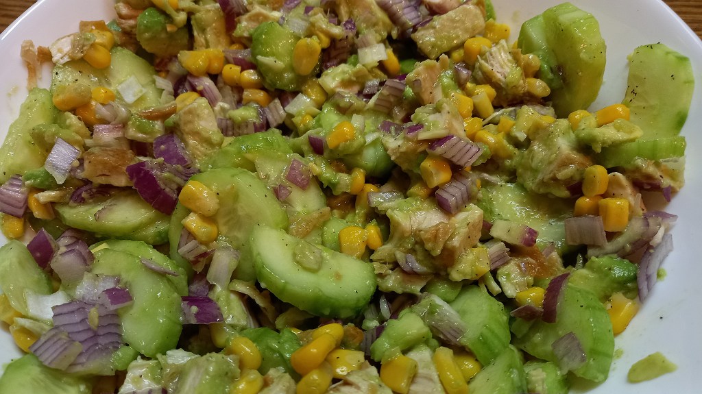 Close-up of avocado cucumber turkey or chicken salad in a bowl