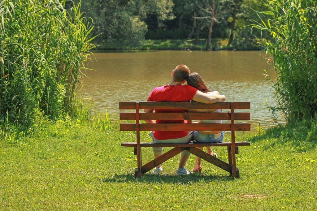 Two lovers on a bench, enjoying time in nature